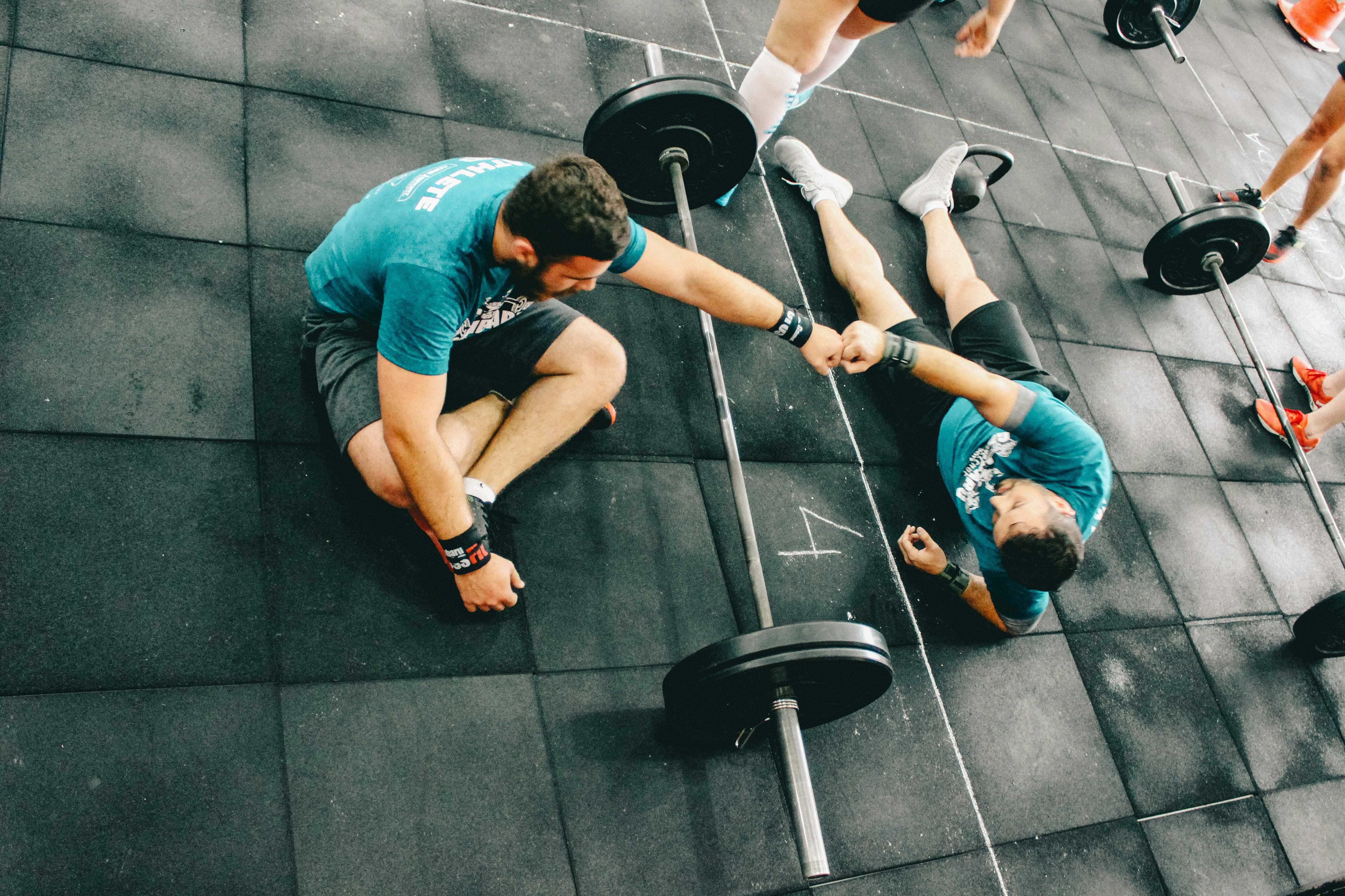 2 gym bros fist bumping